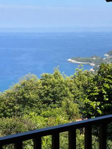 a view of the ocean from a balcony at Om Living Pelion in Agios Dimitrios