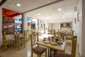 a dining room with a table and chairs at SAN BLAS PLAZA INn in Cusco +39 photos