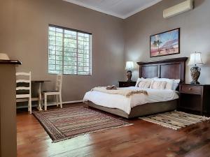 a bedroom with a bed and a desk and a window at The Theatre in Bedford