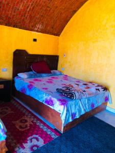 a bedroom with a large bed in a room at Reef Beach Camp in Nuweiba
