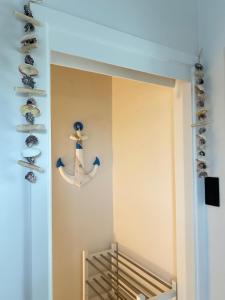 a room with a shelf with shoes on the wall at Strandvilla Zeegloed in Sint-Idesbald +16 photos