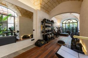 an image of a gym with elliptical equipment in a house at Mohala Boutique Hotel in Diso