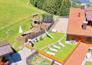 an aerial view of a backyard with a playground at Residenz Erschbaum in Valdaora