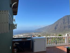 a balcony with a view of the ocean and mountains at Las Toscas in Frontera +1 photo