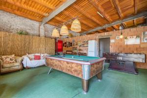 a large room with a pool table in it at Casa Rural Cal Pallol in Camarasa