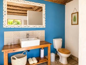 a bathroom with a sink and a toilet at Sava Dunes in Miramar +78 photos