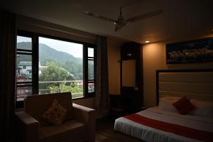 a hotel room with a bed and a window at The Hoften Blue Magnets, Dalhousie in Dalhousie