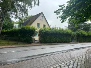 a house on the side of a road at Premium Apart Villa Hamburg in Hamburg