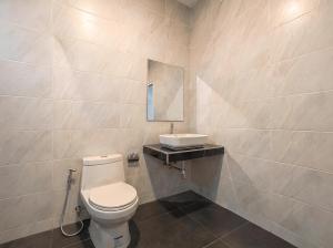 a bathroom with a toilet and a sink at Soul House - Stay Beautifully in Ko Kong Nui