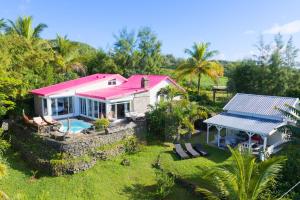 an aerial view of a house with a pink roof at Villa Lorizon in Rodrigues Island