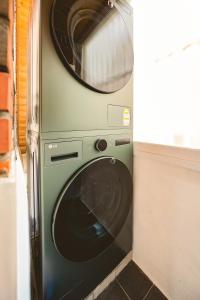 a washing machine with a microwave on top of it at Eunpyeong St Mary's Hospital Yeonsinnae Station 3R3B Bukhansan 인사동 Namsan DDP 동대문 명동 Itaewon 20 mins in Seoul