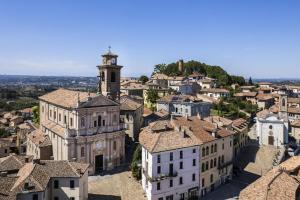 an aerial view of a town with a clock tower at Villa Cristina Suite in Castagnole Lanze