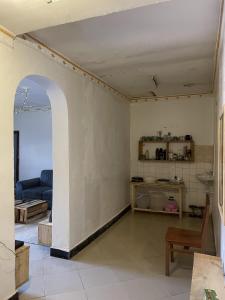 a living room with a couch and a table at Belalonte House, Iringa in Iringa