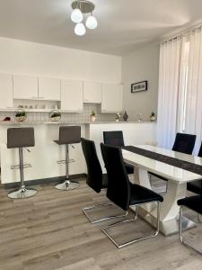 a dining room with a table and chairs at Montebello in Bellinzona