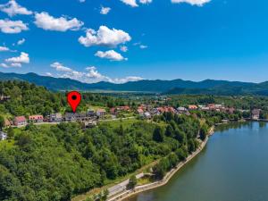 a red heart balloon flying over a river at Villa Orso by Interhome in Fužine