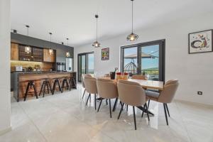 a kitchen and dining room with a table and chairs at Luxury Villa with Indoor Pool and Sauna in Zagreb