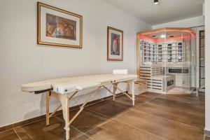 a white table in a room with a glass door at Luxury Villa with Indoor Pool and Sauna in Zagreb