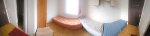 a small room with a bed and a window at Chata pod lesom in Modra +12 photos