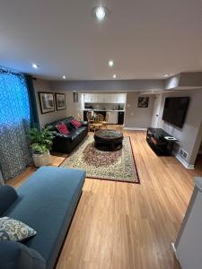a living room with a couch and a table at 2 Bedroom 1 Bathroom Basement Suite in Toronto