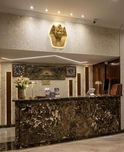 a lobby with a gorilla head on the wall at City Sun Cairo Hotel in Cairo
