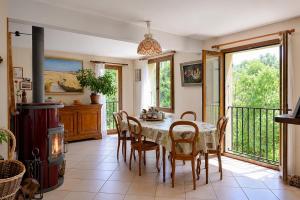 a dining room with a table and chairs at Villa Tromelin in Bouc-Bel-Air