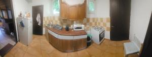 a kitchen with a counter with a microwave in it at Chata pod lesom in Modra
