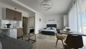 a living room with a bed and a kitchen at Apartments Bojku in Ulcinj