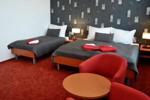 Postel nebo postele na pokoji v ubytování Hotel Limba CTT