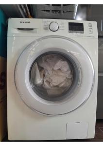 a washing machine with a pile of paper in it at Gala Da Vittoria in Capelas