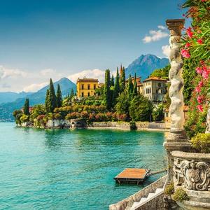 a view of a body of water with buildings and trees at Frenk house over Varenna in Perledo