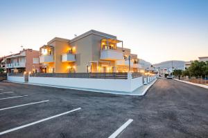 a parking lot in front of a building at Onyro Villas in Karpathos