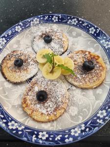 a blue and white plate with three pastries on it at Dar Chauphaly in Houmt Souk