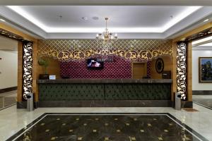 a lobby of a hotel with a chandelier at Alba Resort Hotel - Ultra All Inclusive in Side +80 photos