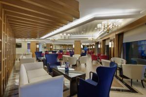 a dining room with chairs and tables and a unintention at Alba Resort Hotel - Ultra All Inclusive in Side
