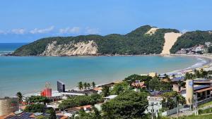 a view of a city and a beach at Flat vista Mar -conforto e estilo em Ponta Negra-Natal in Natal