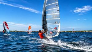 a group of people on sailboats in the water at Appartement "Hartje Haamstede" in Burgh Haamstede