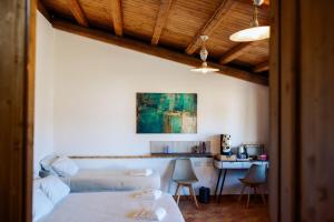 a living room with a couch and a table at Limora' Tenuta Millaci in Mazzarino