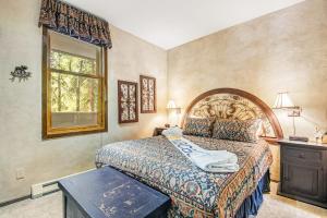 a bedroom with a large bed and a window at 2914 River Bank Lodge - Keystone in Keystone