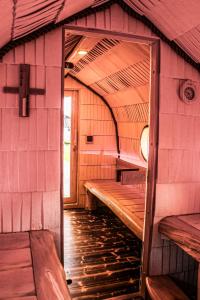 a room with benches in the inside of a building at ''Zunds'' Camping house in Riga