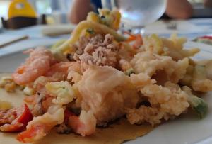 a white plate of food with shrimp and vegetables at Hotel Dolores in Rimini +50 photos