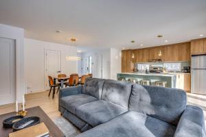 a living room and kitchen with a couch and a table at Private Pool & Spa - Chalet Bella Vista in Saint Come +42 photos