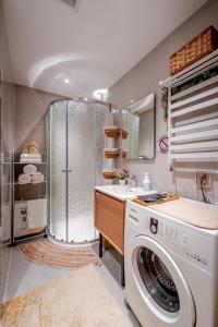 a bathroom with a washing machine and a sink at Ulaanbaatar Heritage Stay in Ulaanbaatar