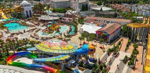 an aerial view of an amusement park with a roller coaster at Rixos Beldibi - Adult Only - The Land of Legends Access in Beldibi