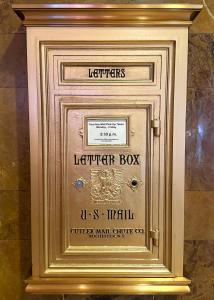 a gold frame with a lightswitch box on a wall at Sports Illustrated Resorts Chicago in Chicago +29 photos