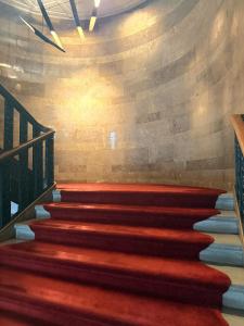 a set of stairs in a building with a stone wall at Sports Illustrated Resorts Chicago in Chicago