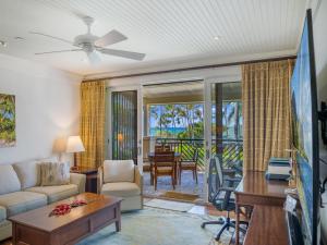 a living room with a couch and a table at 3-Bed Villa 309 at Turtle Bay in Kahuku