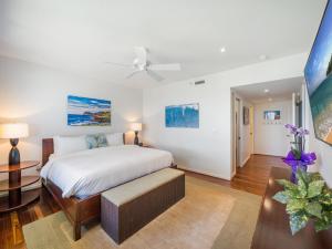 a bedroom with a bed and a ceiling fan at 3-Bed Villa 309 at Turtle Bay in Kahuku +43 photos