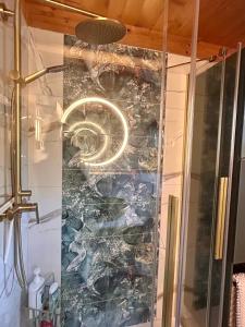 a shower stall with a mural of a seahorse at Ursulas BnB Hemberg View in Hemberg