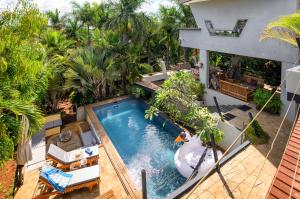 an overhead view of a pool in a villa at Villa Mauritius - Designer Private Studios in Pointe aux Sable