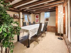 a dining room with a table and chairs at Ye Olde Stone House in Sutton Coldfield +13 photos